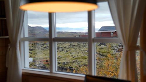 a window with a view of a mountain view at House in lava in Bifrost