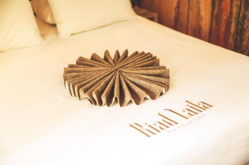 a bed with a star decoration on top of it at Riad Laila in Marrakech