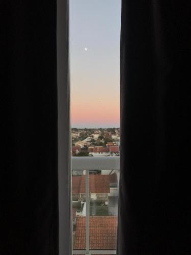 a view of a city from a window at Apartamento Costa del Sol in Mar del Plata