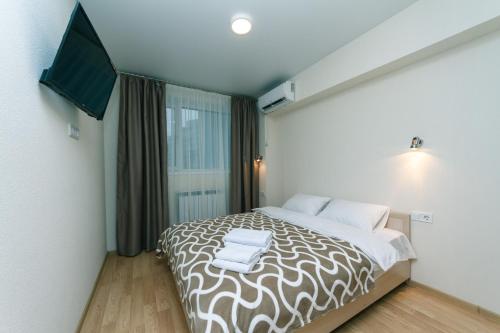 Tempat tidur dalam kamar di My SmartApart Hotel Today
