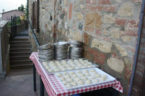 a table with a bunch of dominoes and plates on it at Lo Scricciolo in Montecastelli Pisano
