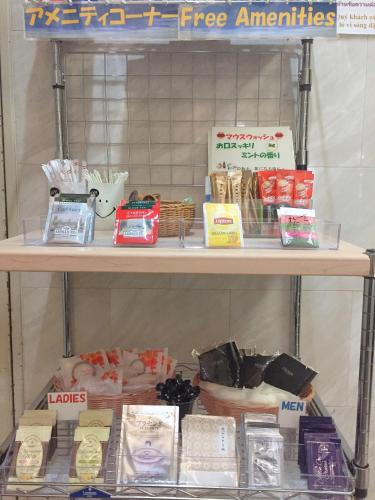 a shelf with many different items on it at Kansai Airport First Hotel in Izumi-Sano