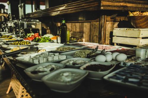 a buffet with many plates of food on a table at Konyak Hotel in Yerevan