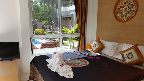 Cama o camas de una habitación en Khun Mai Villa