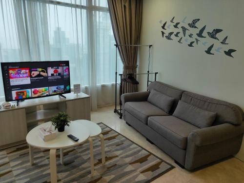 A television and/or entertainment centre at Vortex KLCC by Rainbow