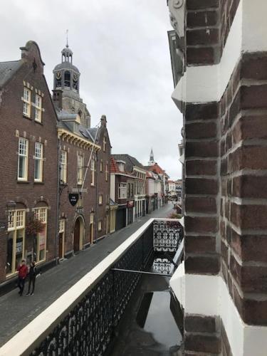 a view of a city street with buildings and a bridge at Cloud9 in Bergen op Zoom