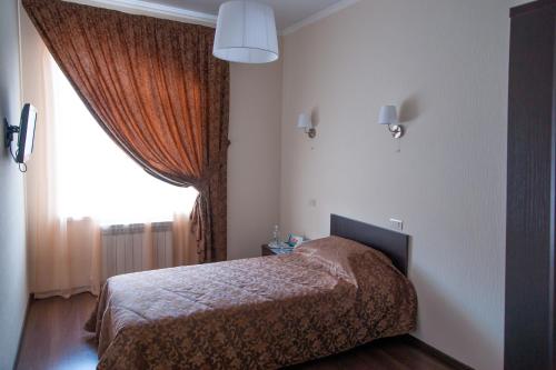 Кровать или кровати в номере Отель Кувака