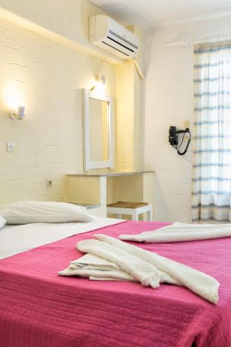 Ένα ή περισσότερα κρεβάτια σε δωμάτιο στο Stratos Apartments & Studios 