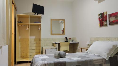 A bed or beds in a room at Biddanòa Bed and Breakfast