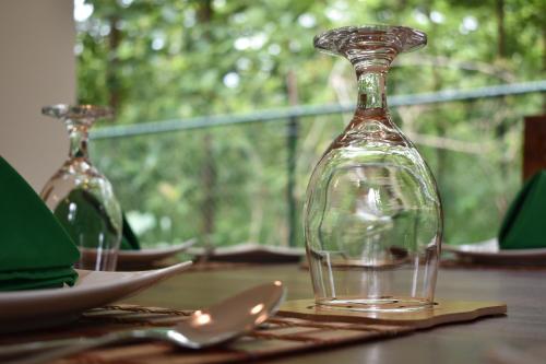 a glass bottle sitting on top of a table at Forest Edge Safari Villa in Udawalawe