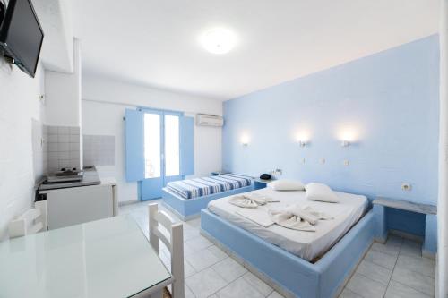 Ένα ή περισσότερα κρεβάτια σε δωμάτιο στο Stratos Apartments & Studios 