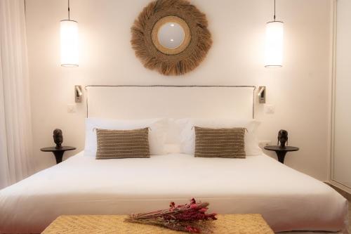Katil atau katil-katil dalam bilik di Hôtel La Dimora & Spa