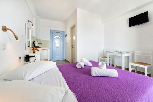 Ένα ή περισσότερα κρεβάτια σε δωμάτιο στο Stratos Apartments & Studios 