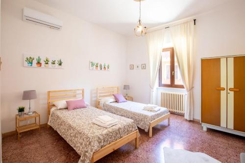 Postel nebo postele na pokoji v ubytování Valle Fiorita