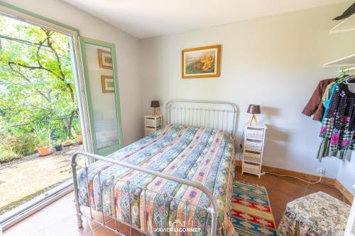 Postel nebo postele na pokoji v ubytování Le Petit Paradis
