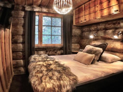Кровать или кровати в номере Ruka Chalet Plage Oliver