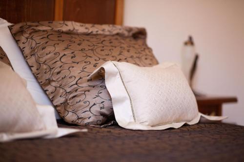 a close up of a bed with a pillow at Valle Fiorita in Castro dei Volsci