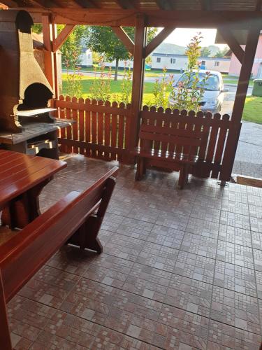 a group of benches sitting in a pavilion at Terme Čatež Apartma Nine in Čatež ob Savi