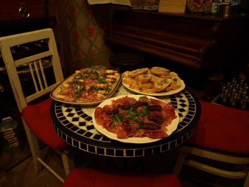 a table with three plates of food on it at Apartmány č.p. 9 in Kouřim