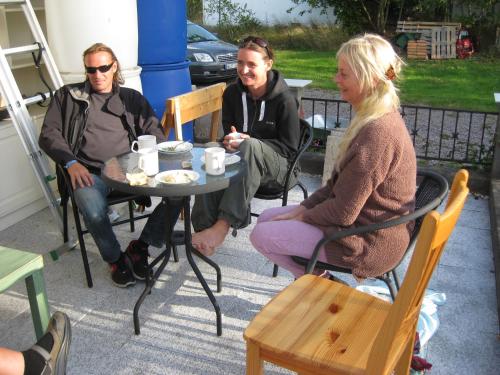 a group of people sitting around a table at Stenslid Bottna By St Anna in Söderköping