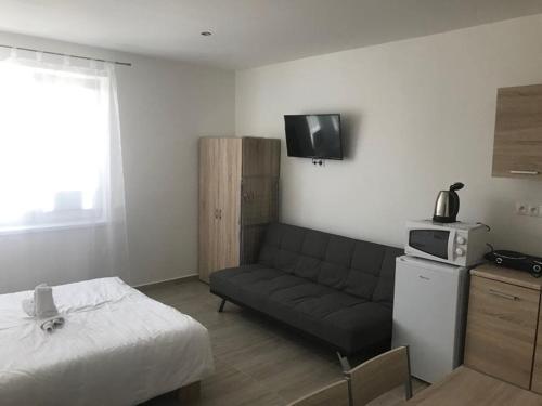 A kitchen or kitchenette at Apartmány Roland