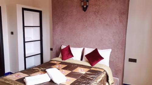 Una cama o camas en una habitación de Asklou Appartement à Mirleft