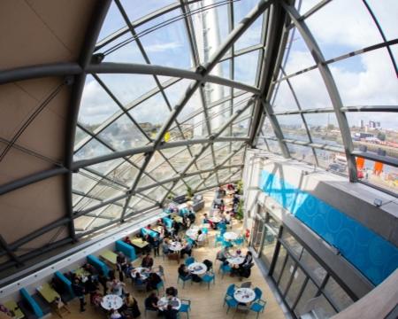 a group of people sitting at tables in a building at Glasgow City Centre - The PENTHOUSE with RiverViews - (Duplex, 3 Bedrooms, 3 Bathrooms, 2 Living rooms/Kitchen, Private SKY Terrace, 2 Parkings, Top Floor, Huge - 2100 sq ft, SECC HYDRO) in Glasgow