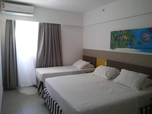 Una cama o camas en una habitación de Apartamento em Olímpia em frente ao Thermas