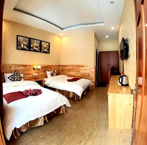 Ένα ή περισσότερα κρεβάτια σε δωμάτιο στο Dang Khoa Garden Inn