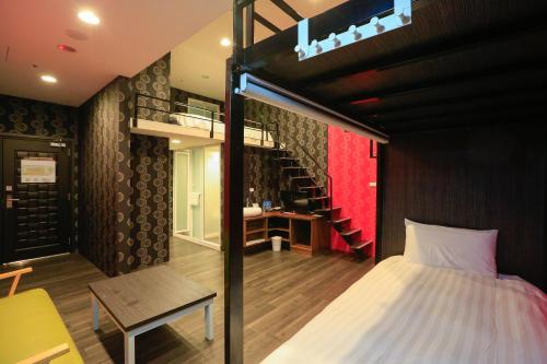 Ένα ή περισσότερα κρεβάτια σε δωμάτιο στο Place‧X Hotel
