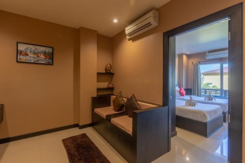 Katil atau katil-katil dalam bilik di Phufa Waree Chiangrai Resort - SHA Extra Plus