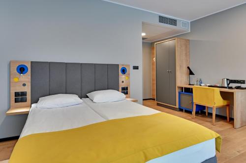 Ένα ή περισσότερα κρεβάτια σε δωμάτιο στο HOTEL NUMBER ONE BY GRANO Gdańsk - GRANO LIFE Gdańsk