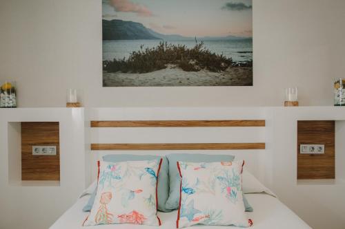 En eller flere senge i et værelse på La Pardela Exclusive Apartamentos