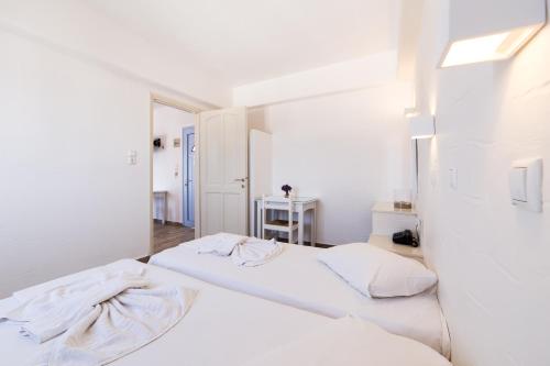 Ένα ή περισσότερα κρεβάτια σε δωμάτιο στο Stratos Apartments & Studios 