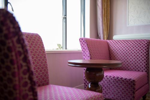 a table and two chairs in a room with a table at Tokyo Bay Maihama Hotel First Resort in Urayasu