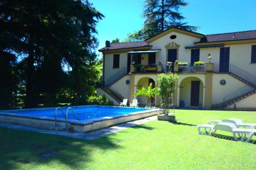 a house with a swimming pool in the yard at La Limonaia - Tremezzo by LoveComo in Tremezzo