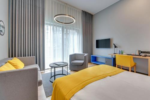Ένα ή περισσότερα κρεβάτια σε δωμάτιο στο HOTEL NUMBER ONE BY GRANO Gdańsk - GRANO LIFE Gdańsk