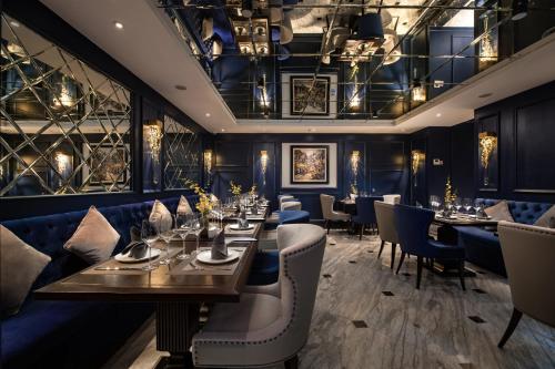 a dining room with long tables and chairs at Soleil Boutique Hotel Hanoi in Hanoi