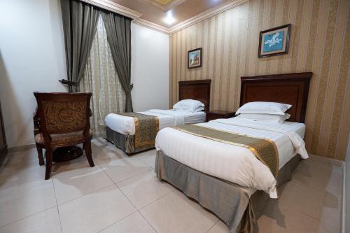 Кровать или кровати в номере Najmet Al Esraa Al Zahabeya