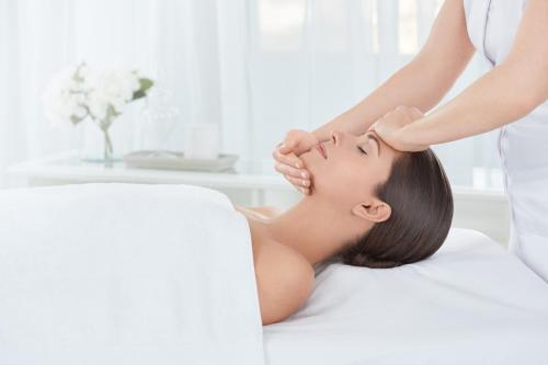 a woman getting a massage from a therapist at Kinsale Hotel & Spa in Kinsale