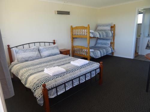 Ένα ή περισσότερα κρεβάτια σε δωμάτιο στο Redgate Country Cottages