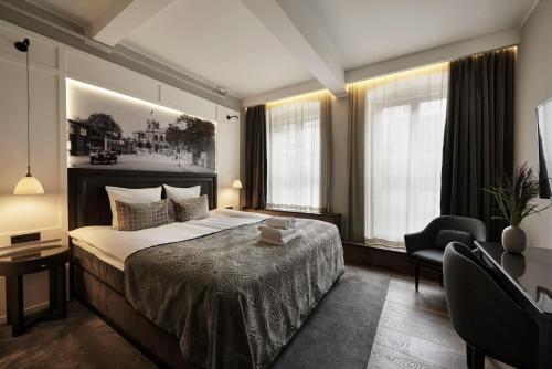 Säng eller sängar i ett rum på Ascot Hotel