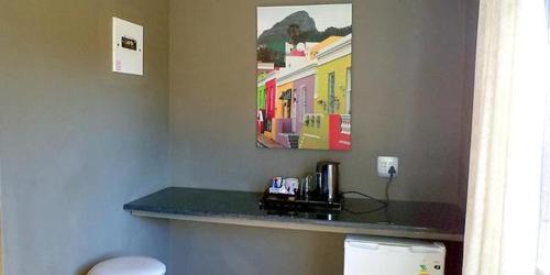 a counter in a hotel room with a counter top at Waterside Lodge CC in Piet Retief