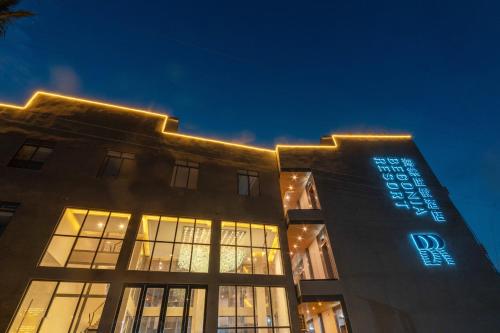 a building with lights on top of it at night at Bohol Panglao Begonia Resort in Panglao