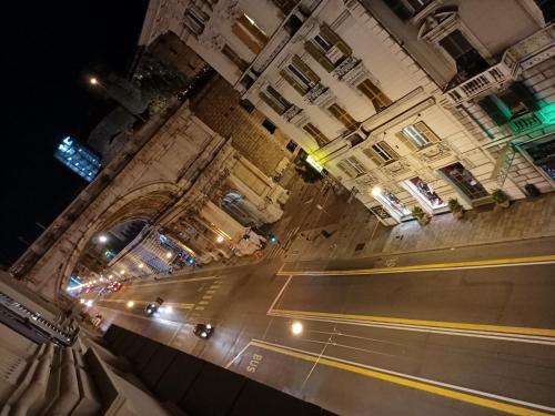 a view of a city street at night at Affittacamere Monumentale in Genova