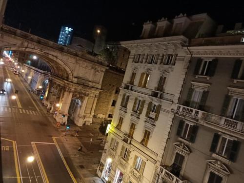 a view of a city street at night at Affittacamere Monumentale in Genova