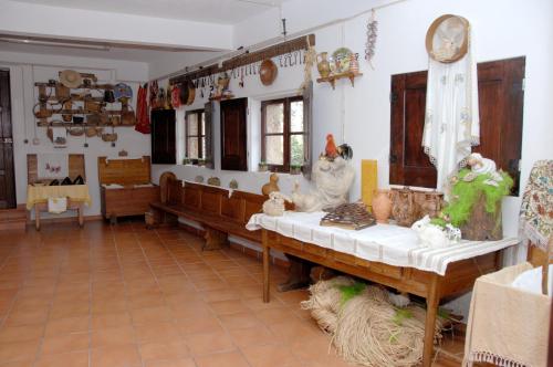 a living room with a table and some items on it at Hotel Quinta Progresso in Macieira de Cambra