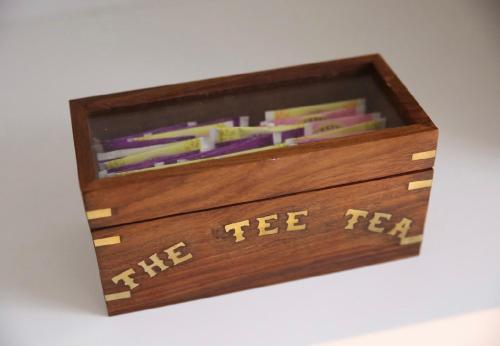 a wooden box with the tie felt written on it at House SottoCoperta in Civitavecchia