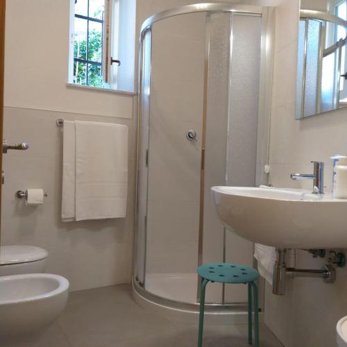 a bathroom with a shower and a sink and a toilet at Il Patio in Manarola