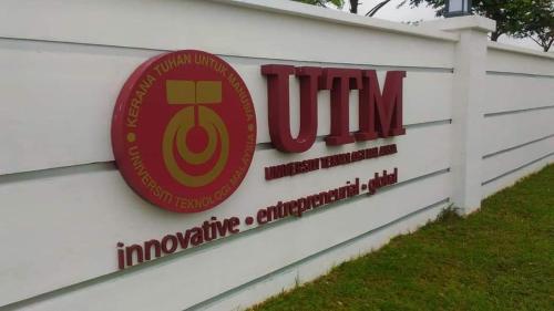 a sign for the university of muncie clinic at Basrie Villa Pagoh - Mini Cinema , Karaoke , Private Pool , WiFi , NetFlix in Muar